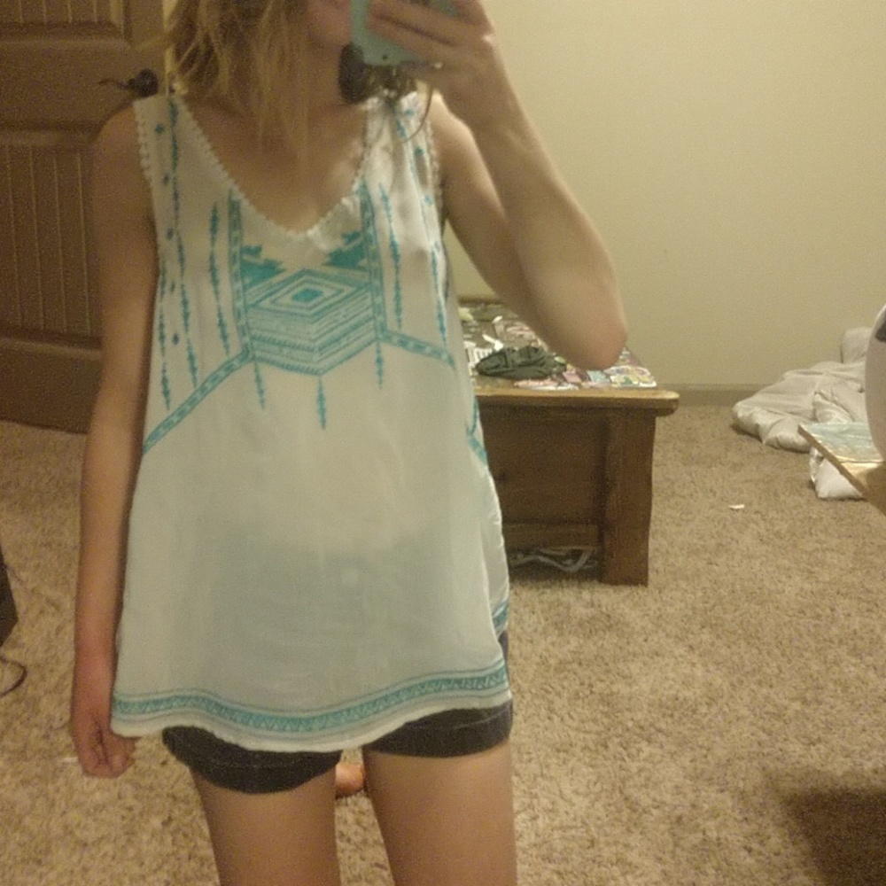 Sheer teal and white stitched tank top.